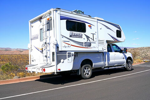 A truck camper is a type of recreational vehicle that is designed to be mounted on the bed of a pickup truck. It is a self-contained unit that includes a living area, kitchen, bathroom, and sleeping quarters.